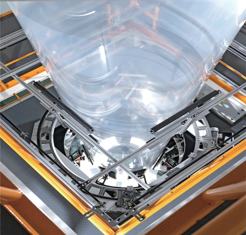 Looking down the tower into the bubble, with the IBC cage and the air ring framed by the platform rails